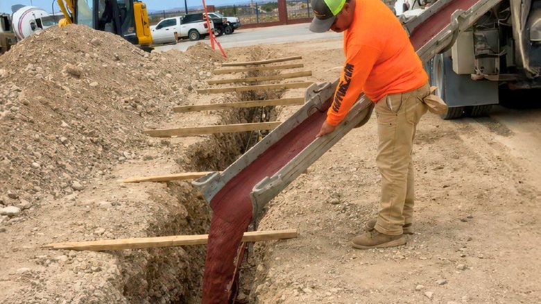 Pouring Red Concrete, Underground Utilities
Site
Solomon Colors
